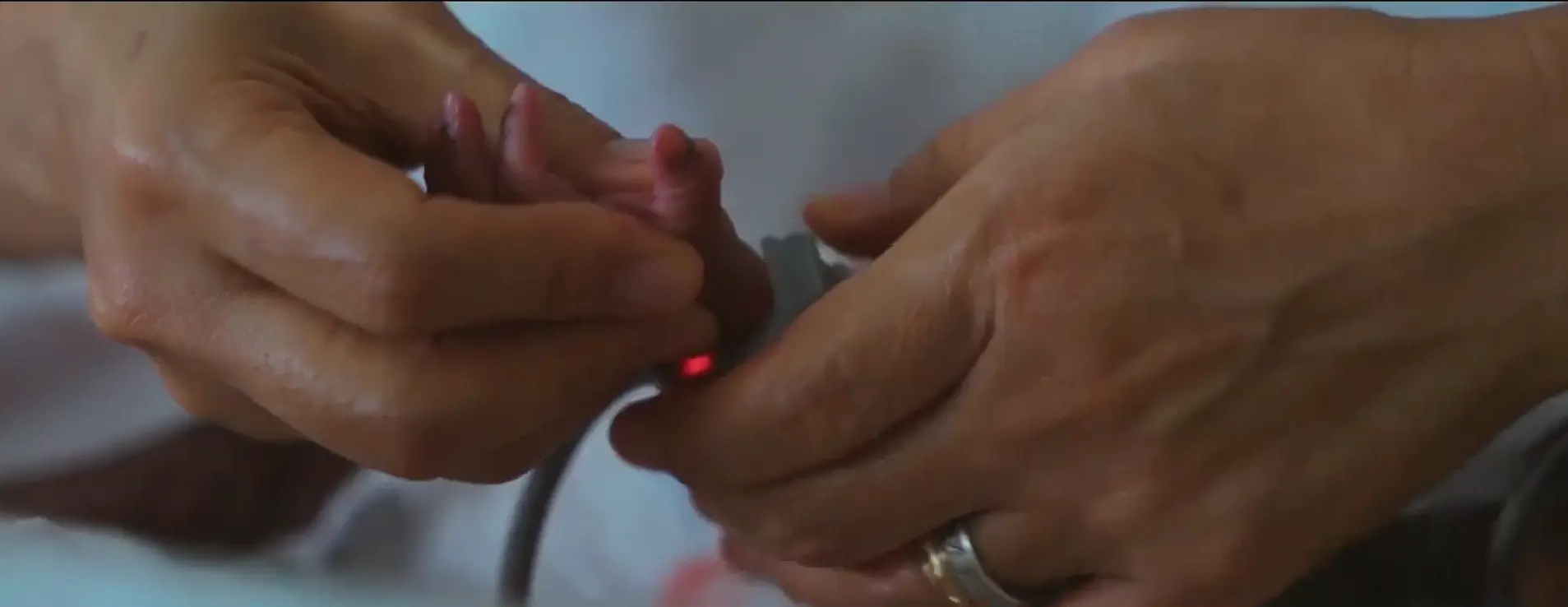 Caring nurse with mother and newborn